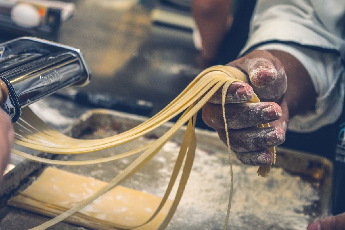 chef using pasta machine
